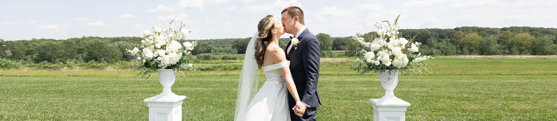 couple kissing in the field